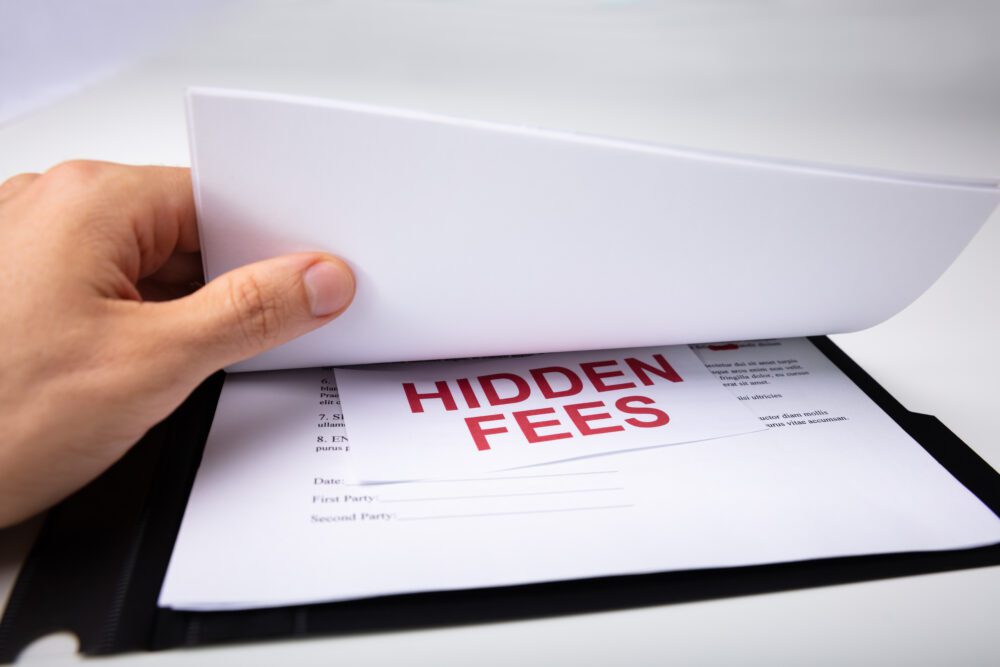Person Looking At Hidden Fees In Contract